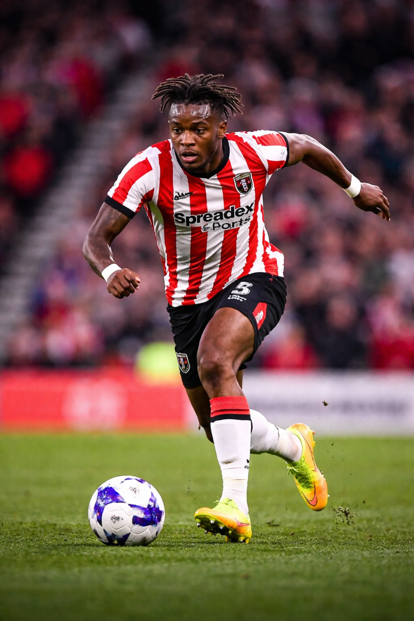 Sunderland winger driving forward with the ball during a Championship match at the Stadium of Light.